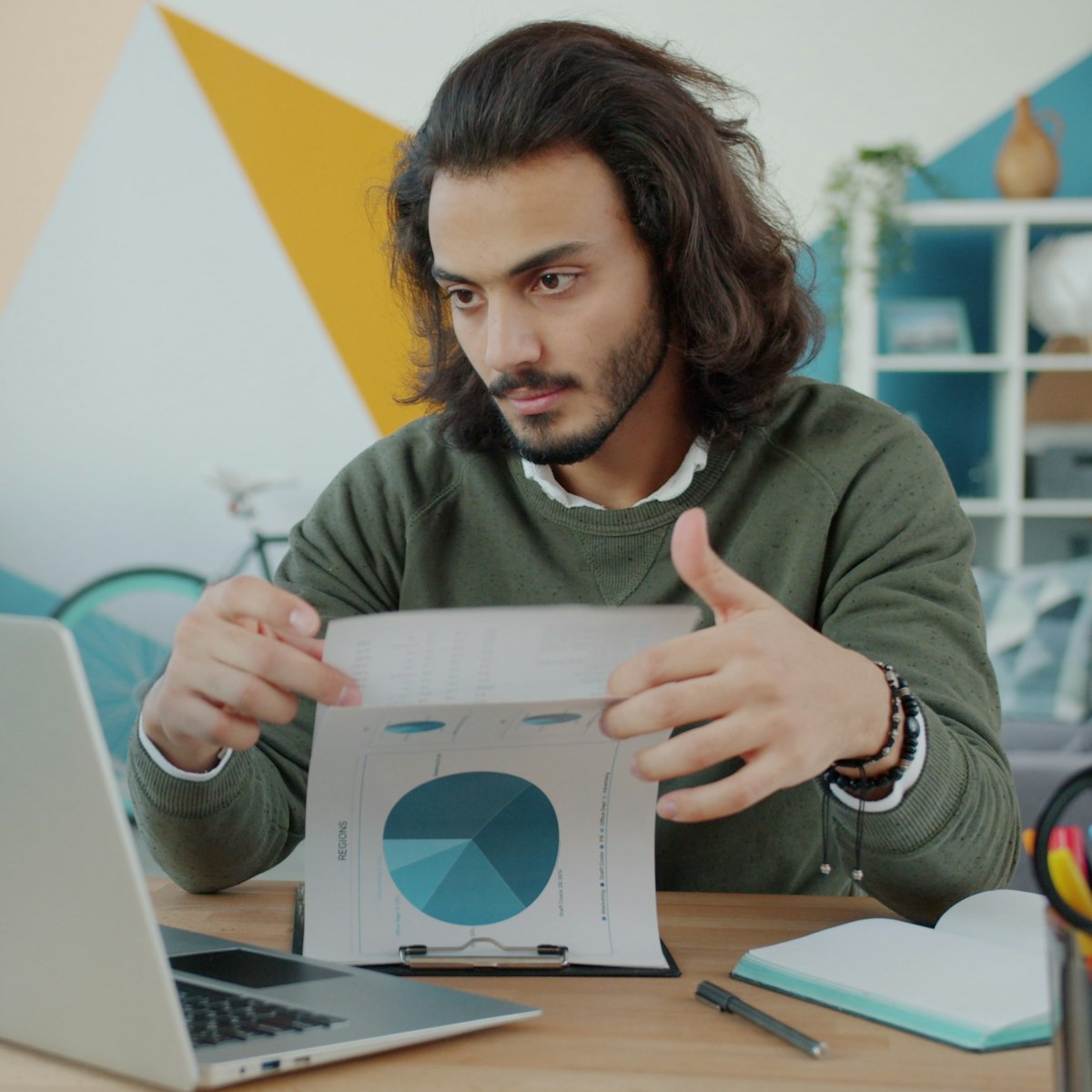 Business owner reviewing reports at a laptop