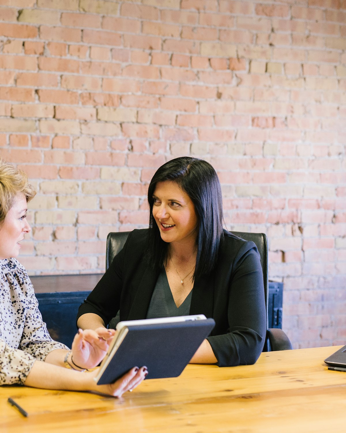Business owner meeting with an advisor at a table